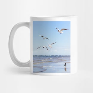 Flock of seagulls flying above the water Mug